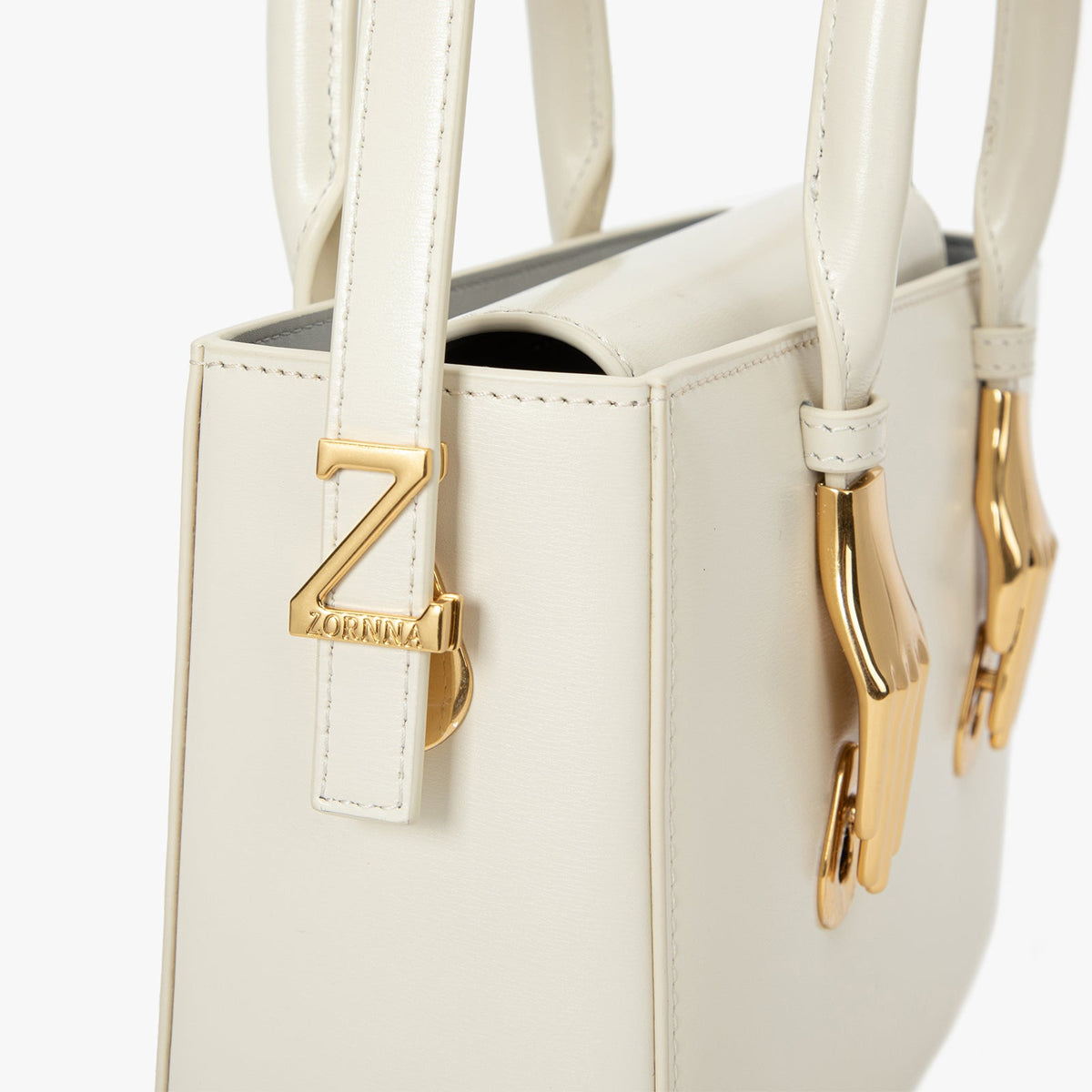 Bolsa de couro da marca Zornna com caixa de marfim